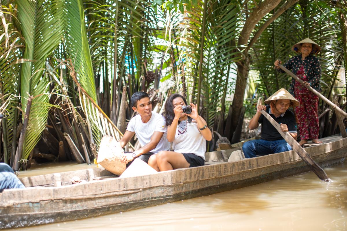 boarding a sampan for a tranquil trip along the picturesque canals