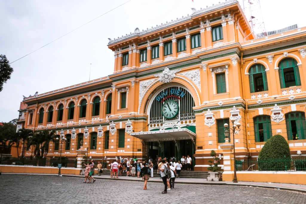 Visitors entering the Saigon Old Post Office, a French colonial landmark featured on the Saigon walking tour.