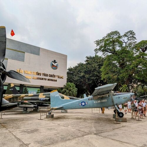 Front view of the War Remnants Museum in Ho Chi Minh City, with two military aircraft displayed outside the entrance. Capturing the historical of vietnam