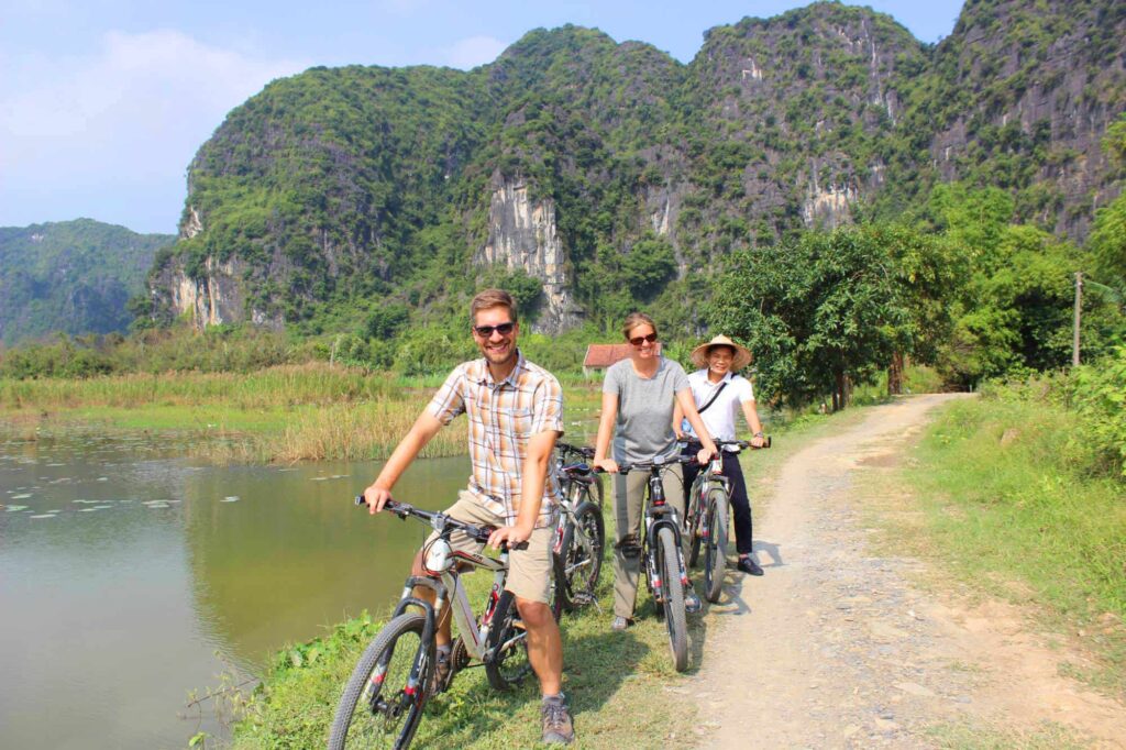 3 travelers enjoy a cycling experience in Ninh Binh
