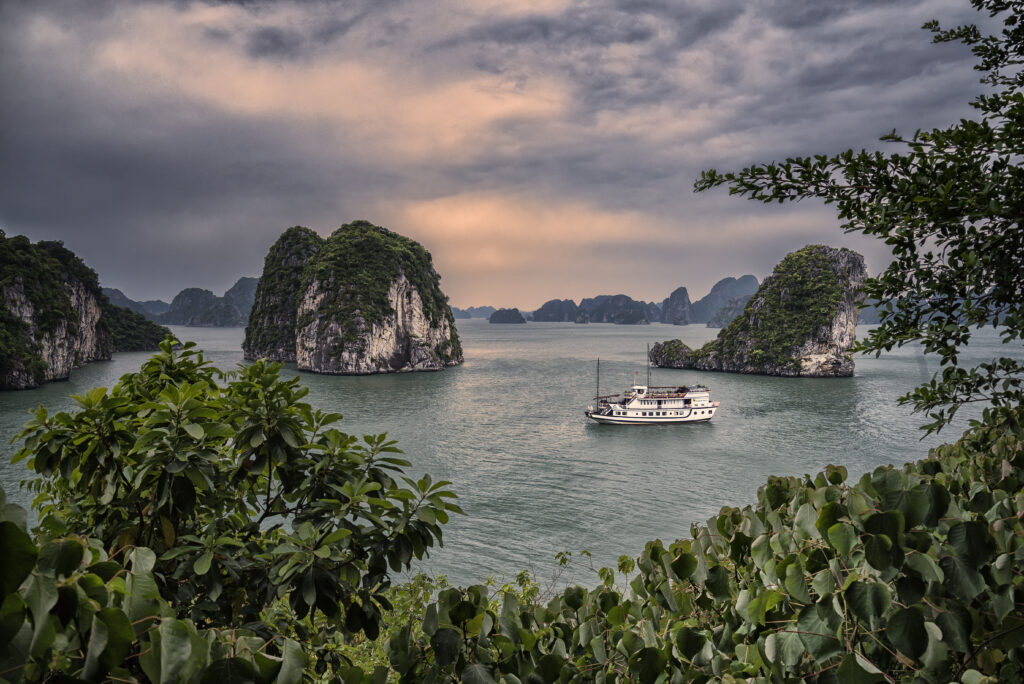 halong bay large view with a cruise in sunset